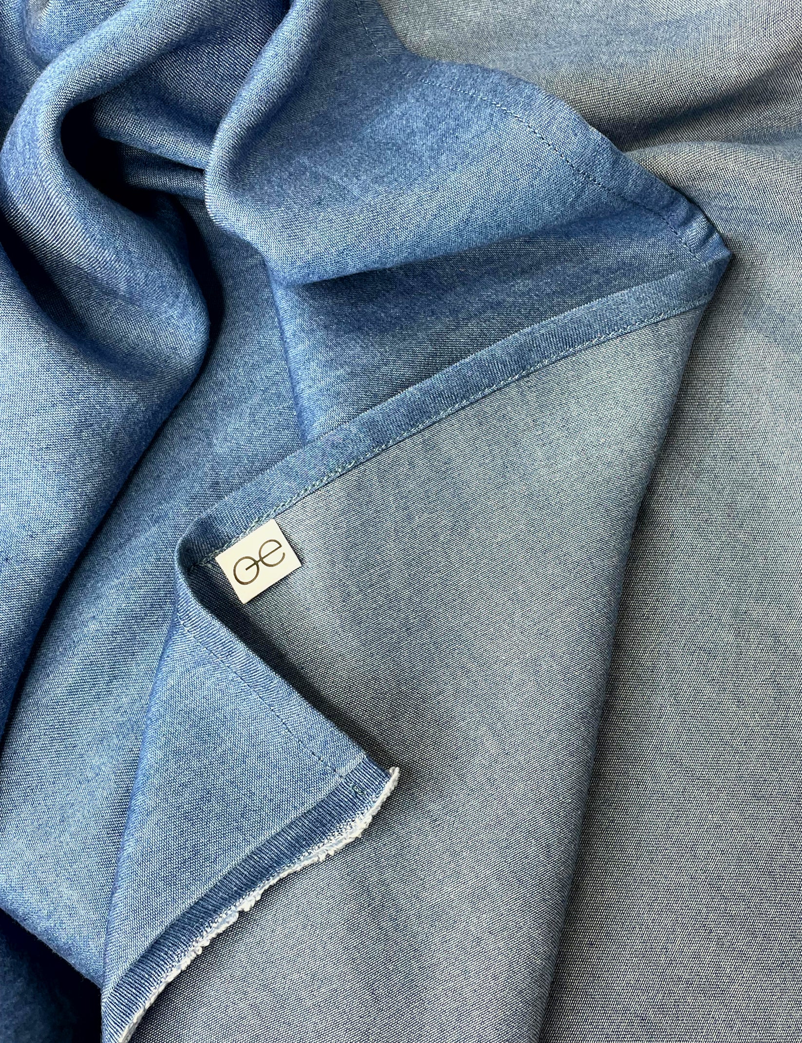 IMG_0727_Groenduk_tencel_mid_blue_denim_70x70_sustainable_scarf_Kopie_crumpled.webp