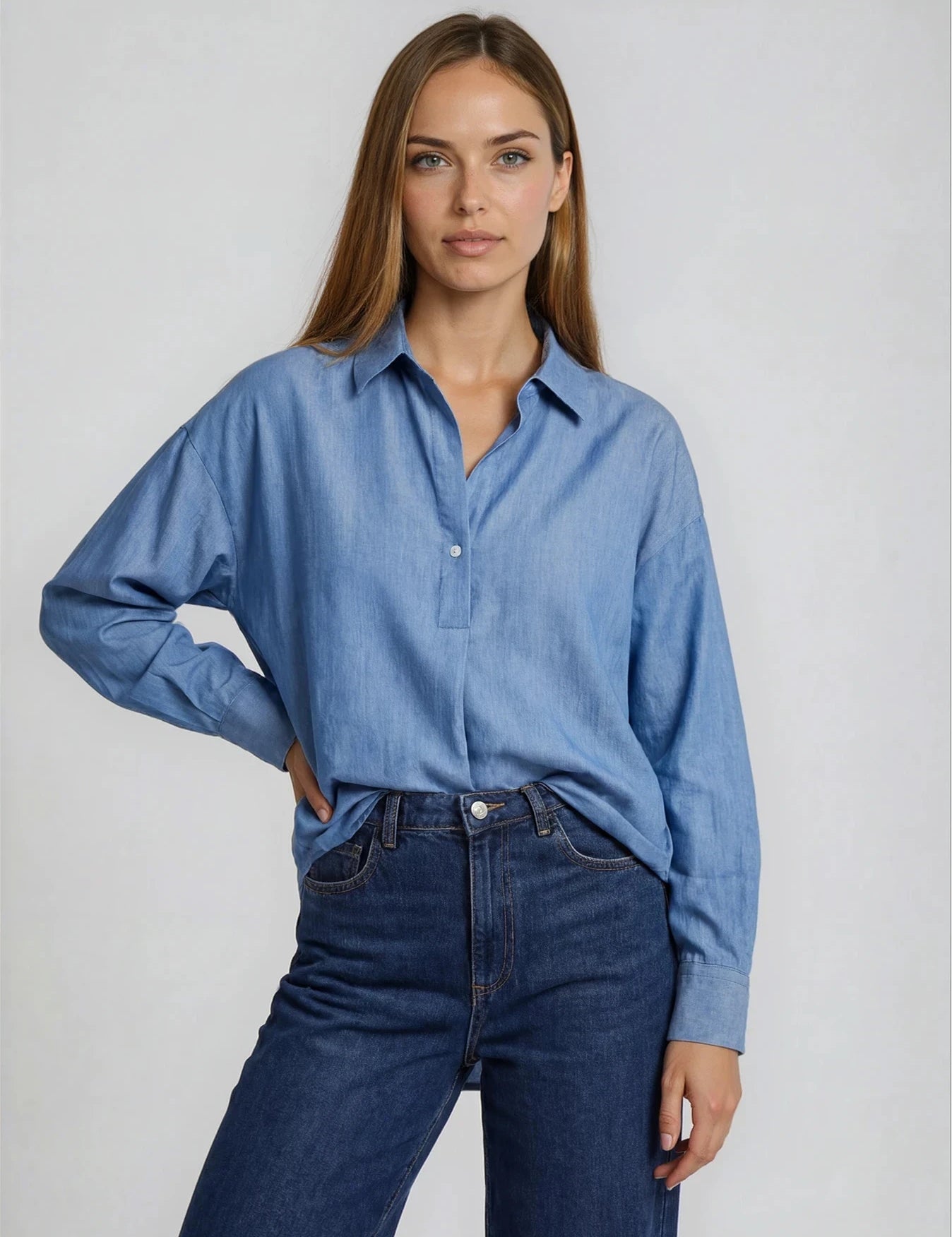 IMG_2512_blouseRaza_oversizedblousewithpleatinfront_tencelmidbluedenim_Flatlay_STRETCHED-ea7a588c-30a8-47e7.webp