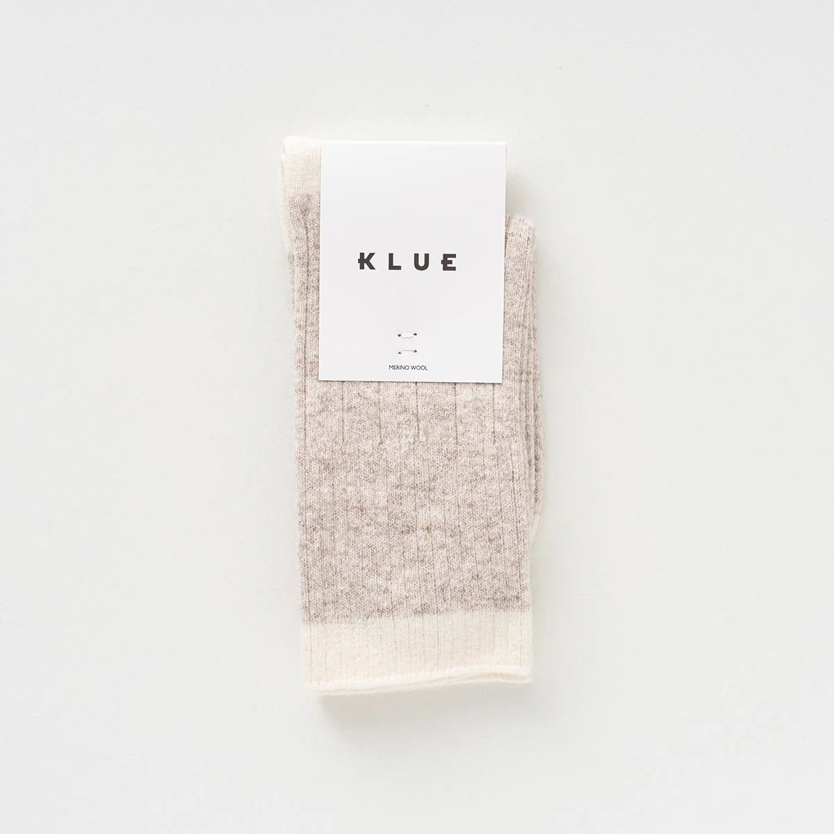 KLUE_BANDS_MERINO_WOOLSOCKS_KLWMNBWSCKSAND_LABEL_BD.webp